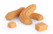 close up image of Janis & Melanie Original Cheese Straws with cubes of cheddar cheese