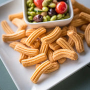 a plate of Original Cheese Straws and a bowl of edamame salad