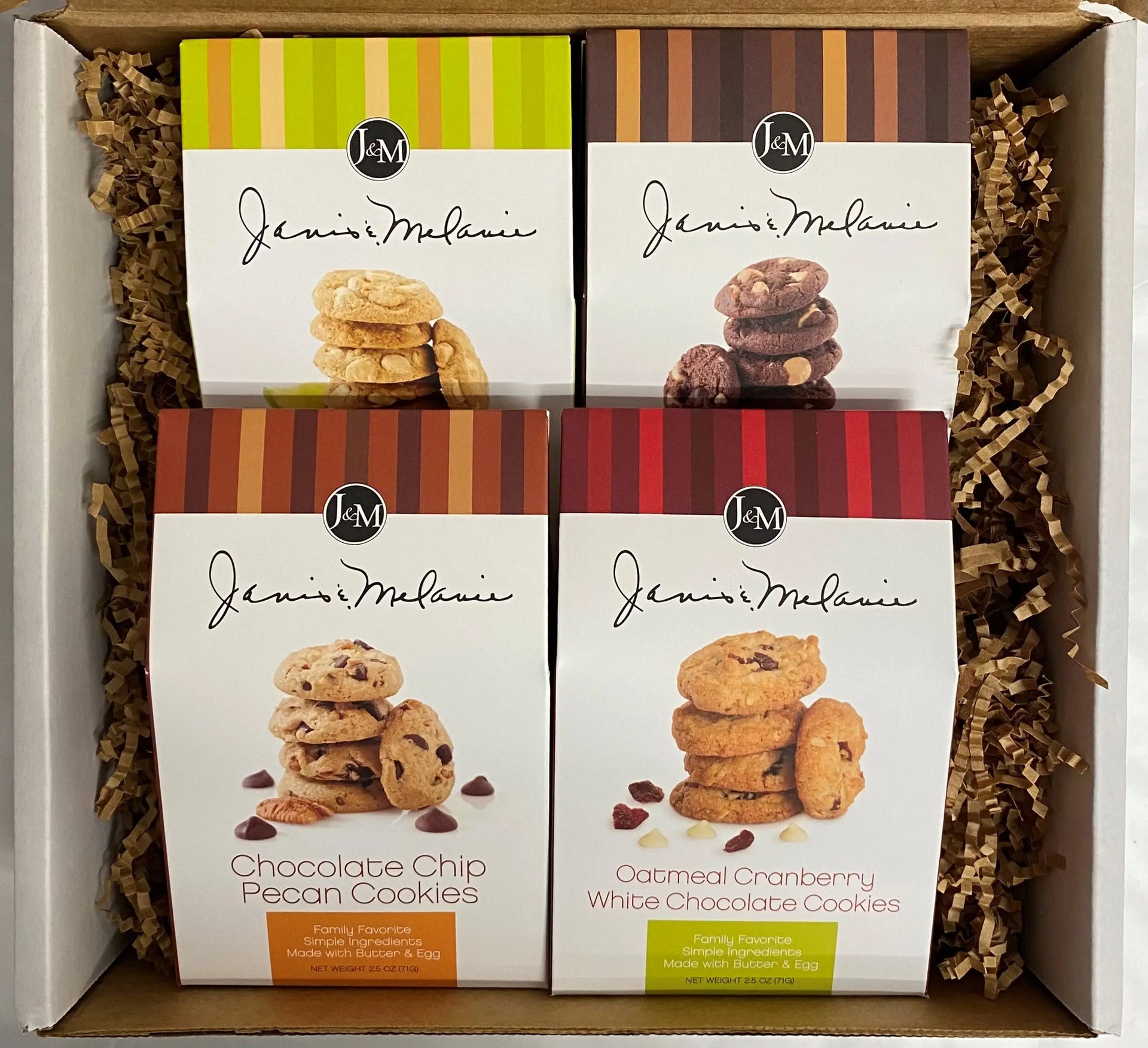 Four 2.5 oz traditional cookies displayed inside an open Janis & Melanie Food = Love gift box