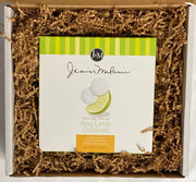 A small Food=Love box with a 10oz box of Janis and Melanie Key Lime Tea Cookies, cushioned with kraft krinkle paper packaging.