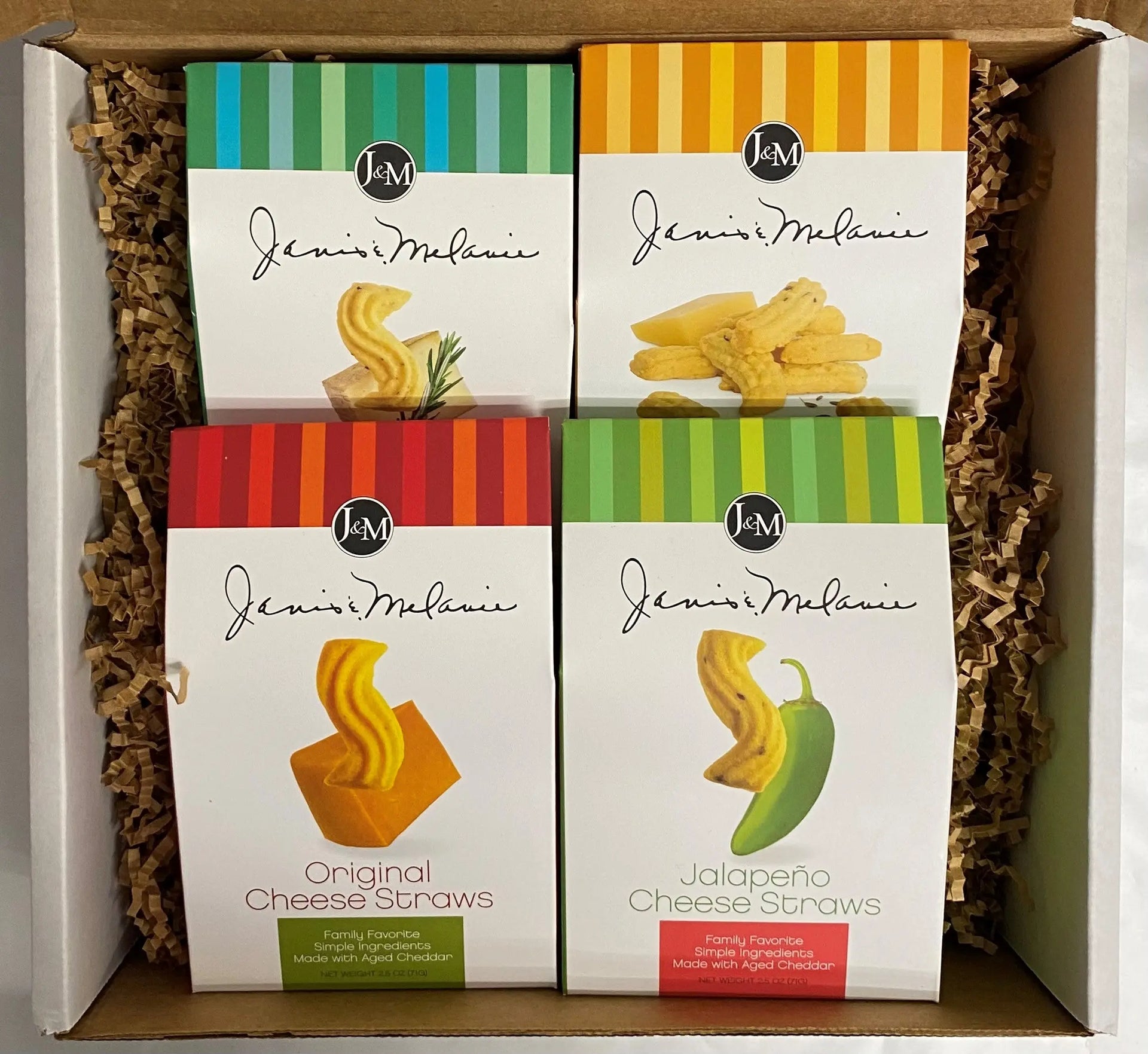 Cheese straws displayed inside an open Janis & Melanie Food = Love gift box