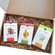 An assortment of favorite Janis & Melanie treats inside an open Food = Love gift box